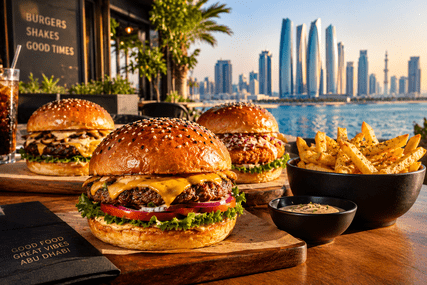 Gourmet burgers and crispy fries served at a waterfront restaurant overlooking Abu Dhabi's skyline in 2026.